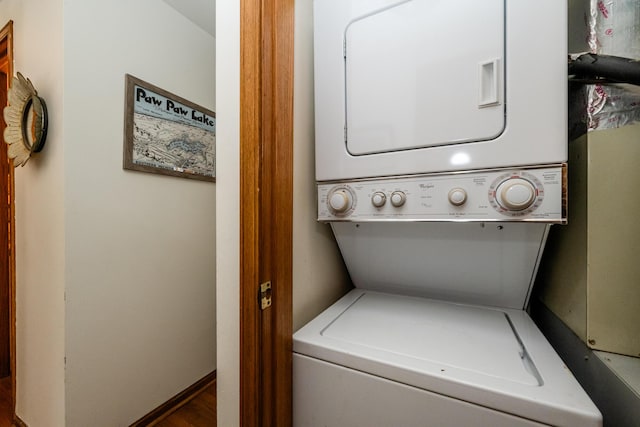 5576 N Watervliet Rd Unit 11, Watervliet, MI 49098 - laundry room with stacked washing machine and dryer and wood finished floors