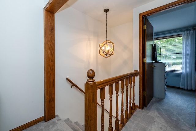 5576 N Watervliet Rd Unit 11, Watervliet, MI 49098 - staircase featuring carpet flooring, a chandelier, and baseboards