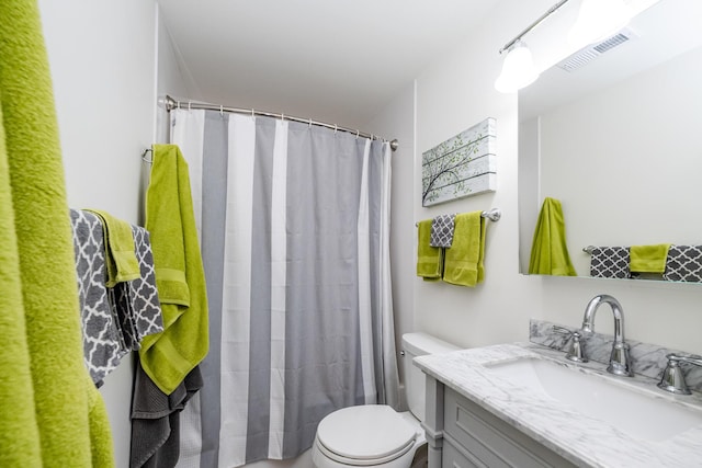 5576 N Watervliet Rd Unit 11, Watervliet, MI 49098 - bathroom with toilet, vanity, and curtained shower