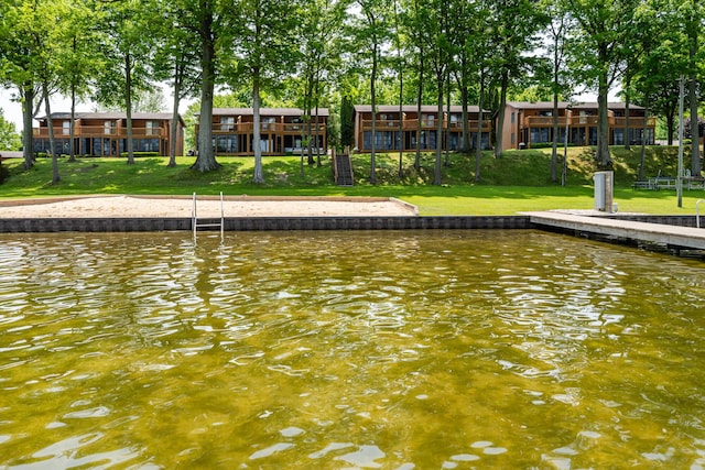 5576 N Watervliet Rd Unit 11, Watervliet, MI 49098 - dock area featuring a water view and a lawn