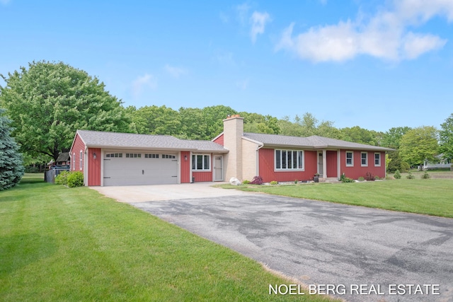 16507 Sleeper St, Grand Haven, MI 49417 - ranch-style house featuring driveway, an attached garage, a chimney, and a front lawn
