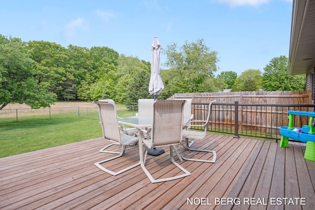 16507 Sleeper St, Grand Haven, MI 49417 - wooden deck featuring outdoor dining area