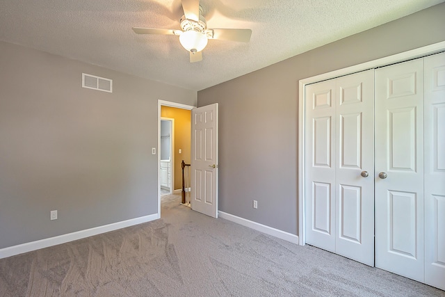 1196 Rathfon Cir, Saline, MI 48176 - unfurnished bedroom with carpet, a closet, a textured ceiling, baseboards, and ceiling fan