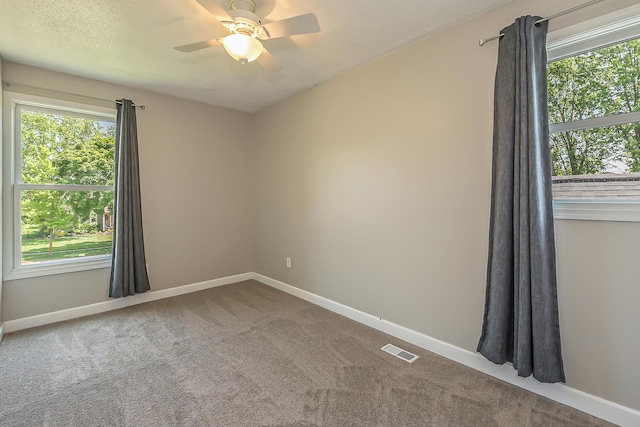 1196 Rathfon Cir, Saline, MI 48176 - unfurnished room with carpet flooring, a ceiling fan, and baseboards