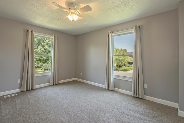 1196 Rathfon Cir, Saline, MI 48176 - carpeted empty room featuring ceiling fan, a textured ceiling, and baseboards