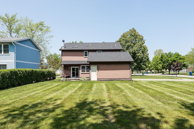 1196 Rathfon Cir, Saline, MI 48176 - back of house featuring a yard and a shingled roof