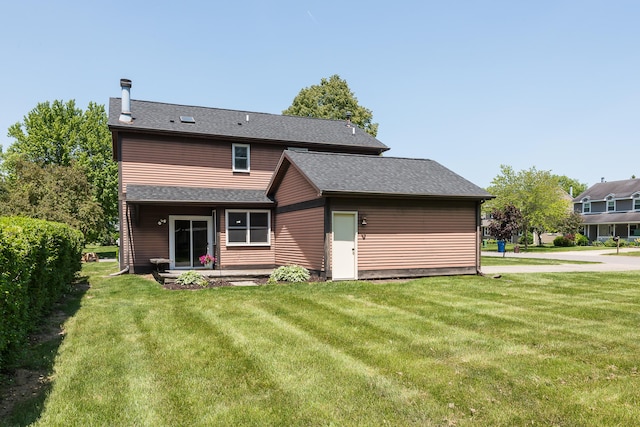 1196 Rathfon Cir, Saline, MI 48176 - rear view of property with a lawn and a shingled roof