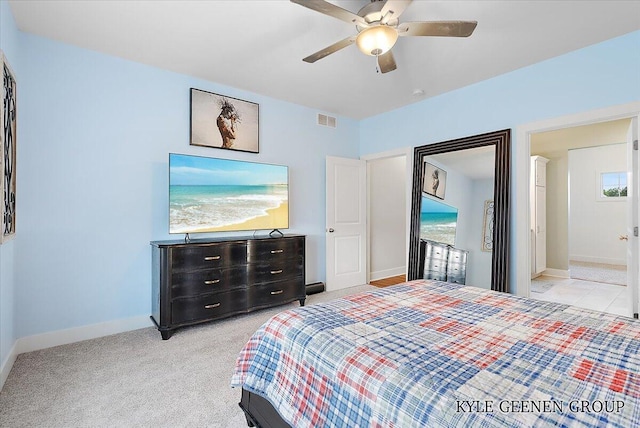 4745 W Lake Dr, Holland, MI 49423 - bedroom with baseboards, a ceiling fan, and light colored carpet