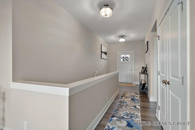 4745 W Lake Dr, Holland, MI 49423 - hallway featuring dark wood finished floors and baseboards