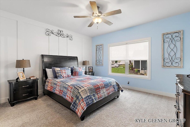 4745 W Lake Dr, Holland, MI 49423 - bedroom with light colored carpet, baseboards, and a ceiling fan