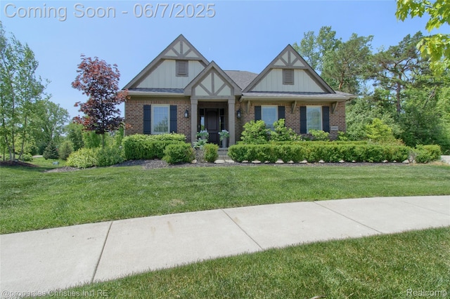 49062 Honey Tree Ct, Northville, MI 48168 - view of front facade featuring brick siding, a front lawn, and board and batten siding