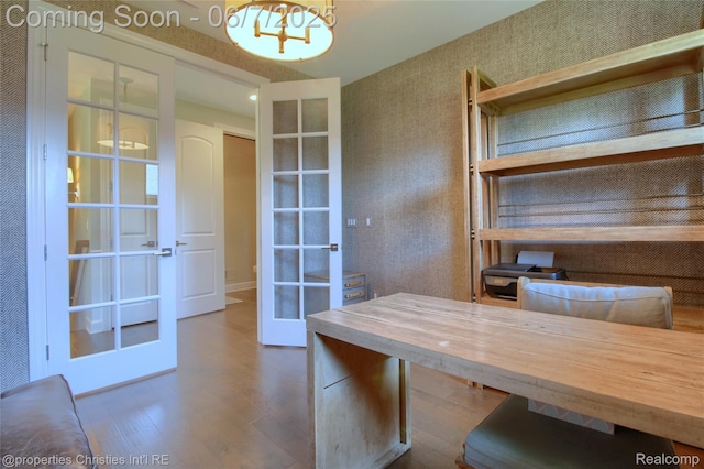 49062 Honey Tree Ct, Northville, MI 48168 - office space with french doors, wood finished floors, a chandelier, and wallpapered walls