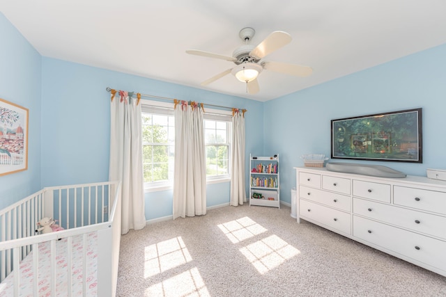 6240 Vineyard Ave, Ann Arbor, MI 48108 - bedroom with light carpet, a crib, baseboards, and a ceiling fan