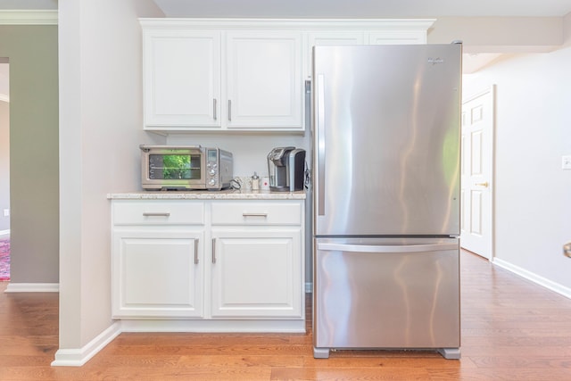 6240 Vineyard Ave, Ann Arbor, MI 48108 - kitchen featuring freestanding refrigerator, light wood finished floors, and baseboards