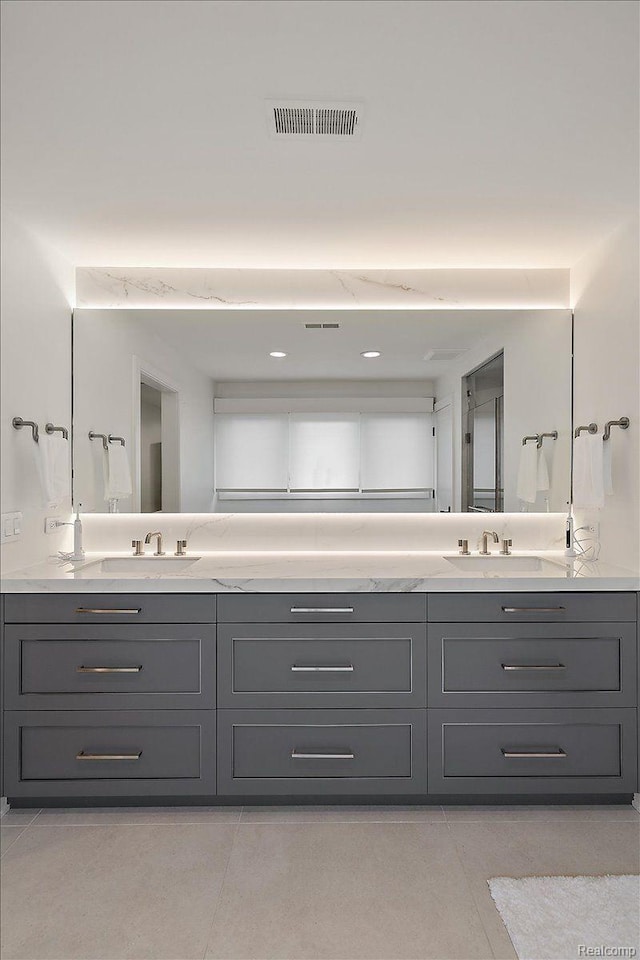 647 Ann St, Birmingham, MI 48009 - bathroom featuring double vanity and tile patterned floors