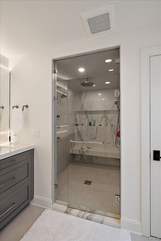 647 Ann St, Birmingham, MI 48009 - full bathroom featuring a marble finish shower, vanity, baseboards, and recessed lighting
