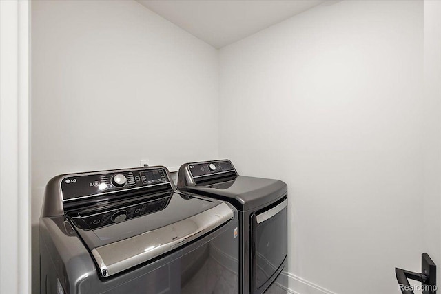 647 Ann St, Birmingham, MI 48009 - washroom with washer and dryer and baseboards