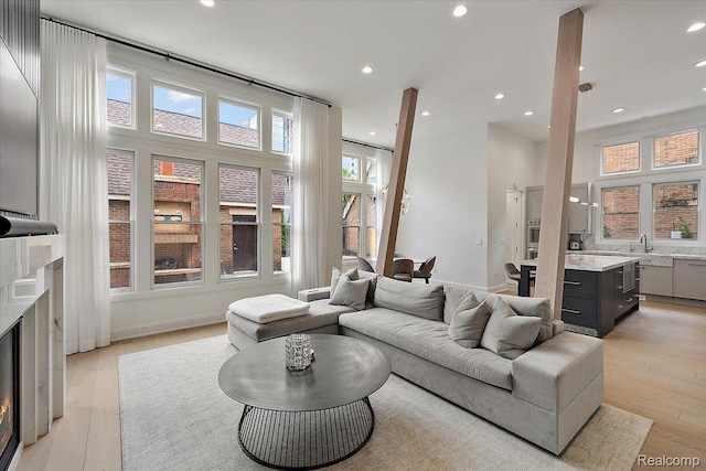 647 Ann St, Birmingham, MI 48009 - living area featuring light wood-type flooring, recessed lighting, and baseboards