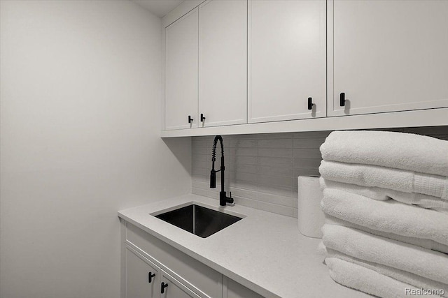 647 Ann St, Birmingham, MI 48009 - bar area featuring a sink and decorative backsplash