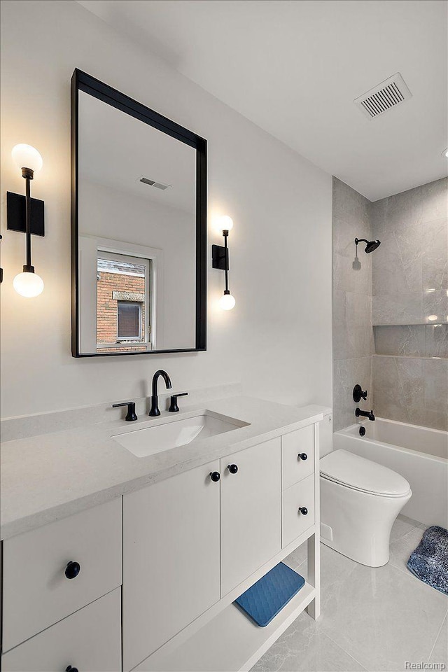 647 Ann St, Birmingham, MI 48009 - full bath with vanity, toilet, shower / bathtub combination, and marble finish floors