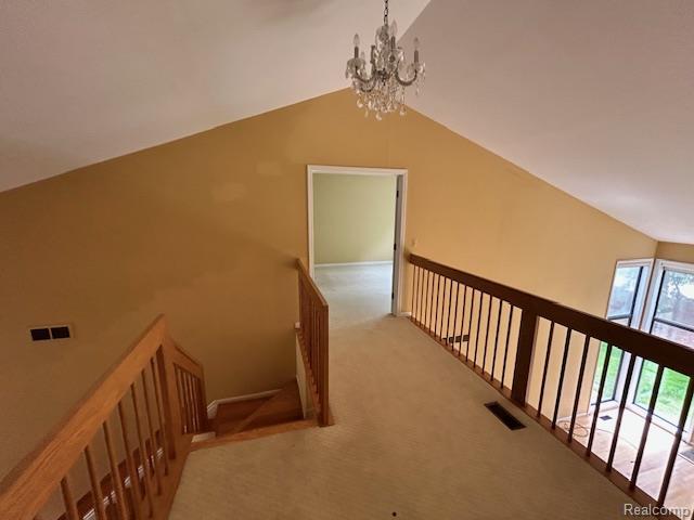 692 Brockmoor Ln, Bloomfield, MI 48304 - corridor featuring a chandelier, carpet, an upstairs landing, and lofted ceiling