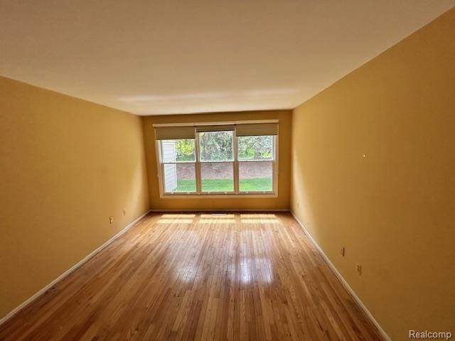 692 Brockmoor Ln, Bloomfield, MI 48304 - unfurnished room with wood finished floors and baseboards