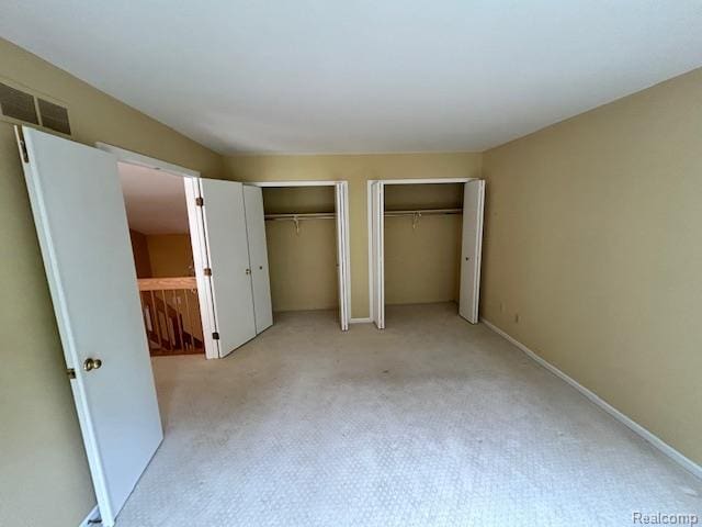 692 Brockmoor Ln, Bloomfield, MI 48304 - unfurnished bedroom with multiple closets and carpet