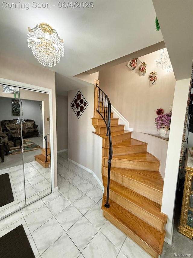 35677 Tina Dr, Warren, MI 48310 - stairs featuring a chandelier and baseboards