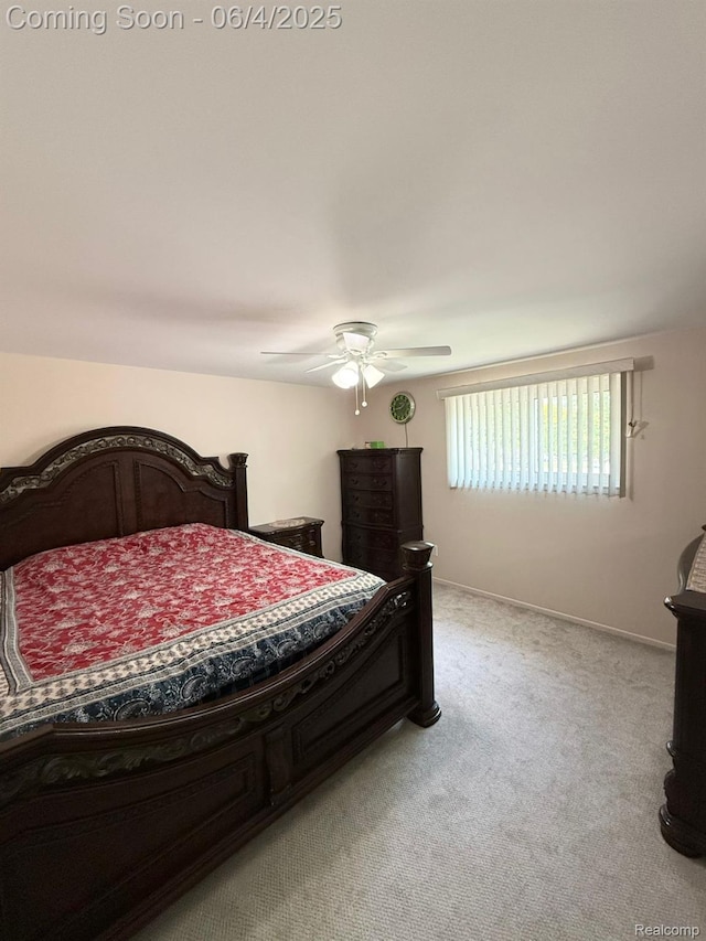 35677 Tina Dr, Warren, MI 48310 - bedroom with light carpet, ceiling fan, and baseboards