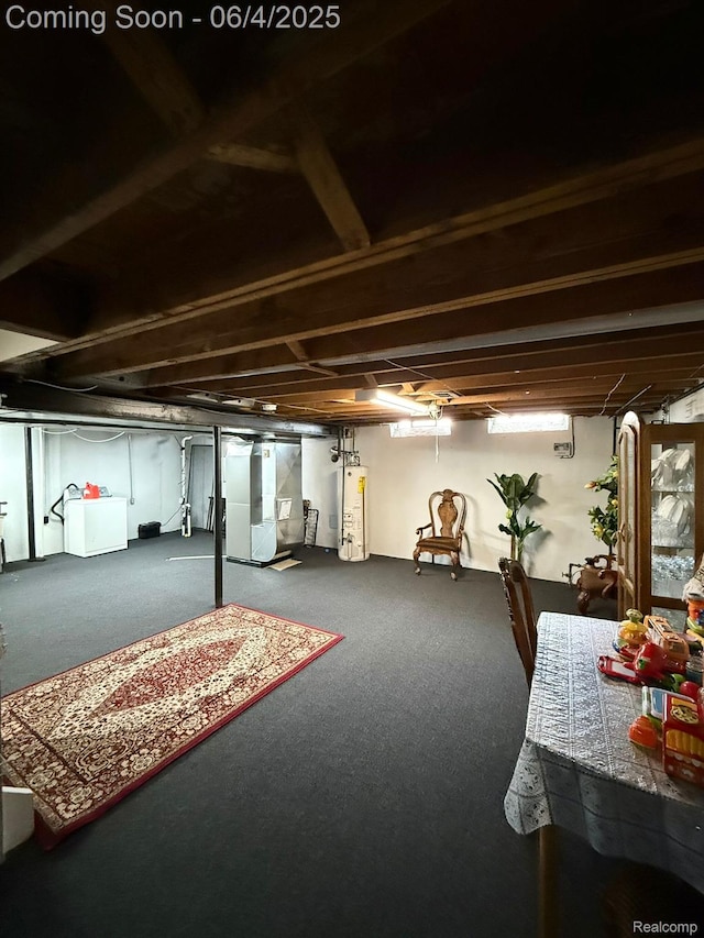 35677 Tina Dr, Warren, MI 48310 - below grade area featuring gas water heater, carpet floors, and washing machine and dryer