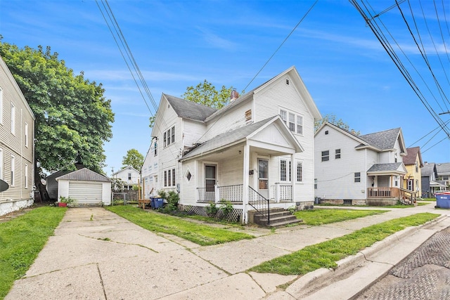 828 Nagold St NW, Grand Rapids, MI 49504 - view of front of property with a detached garage, an outdoor structure, a porch, and a residential view