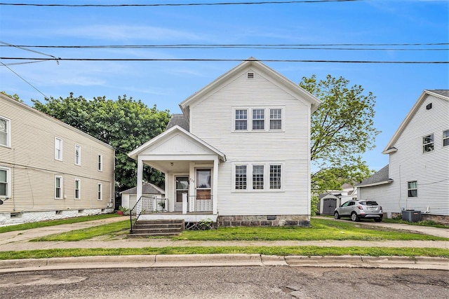 828 Nagold St NW, Grand Rapids, MI 49504 - view of front facade featuring a porch and central AC unit