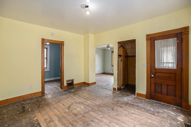 828 Nagold St NW, Grand Rapids, MI 49504 - entrance foyer with hardwood / wood-style floors, baseboards, arched walkways, and ceiling fan