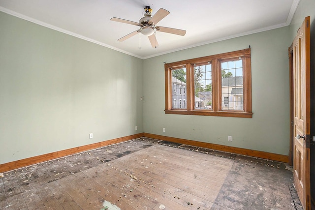 828 Nagold St NW, Grand Rapids, MI 49504 - spare room with baseboards, a ceiling fan, ornamental molding, and hardwood / wood-style floors
