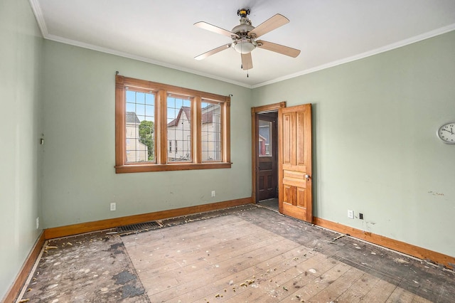 828 Nagold St NW, Grand Rapids, MI 49504 - empty room featuring baseboards, ornamental molding, a ceiling fan, and hardwood / wood-style floors