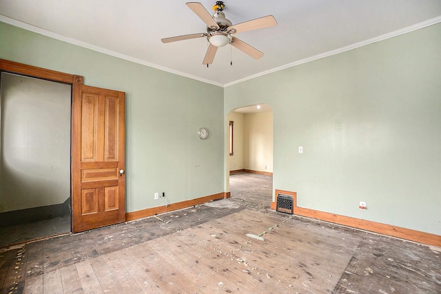 828 Nagold St NW, Grand Rapids, MI 49504 - unfurnished room featuring arched walkways, a ceiling fan, ornamental molding, and baseboards