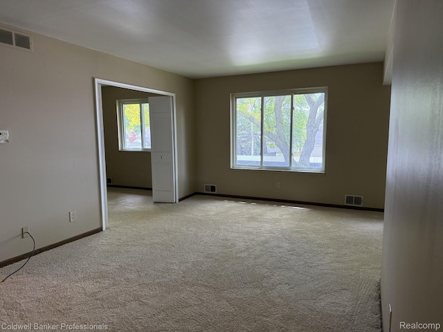 22860 9 Mile Rd Unit 16, Saint Clair Shores, MI 48080 - spare room featuring carpet and baseboards