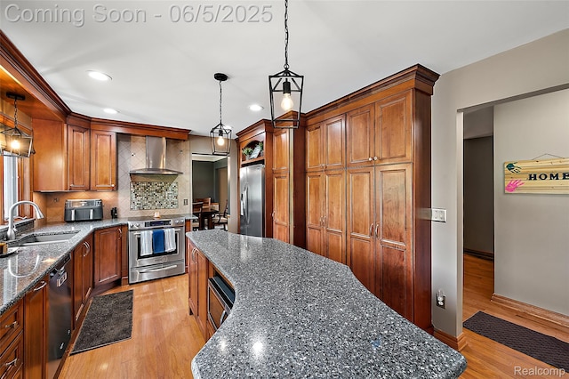 6730 Whiting Dr, Troy, MI 48098 - kitchen with stainless steel appliances, a sink, wall chimney exhaust hood, backsplash, and recessed lighting