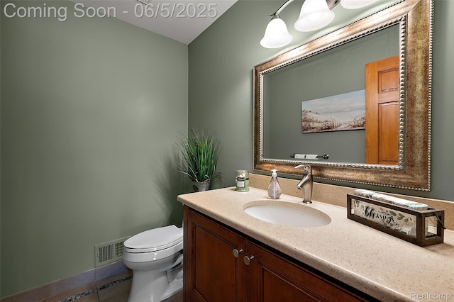 6730 Whiting Dr, Troy, MI 48098 - half bathroom with vanity, toilet, and tile patterned flooring