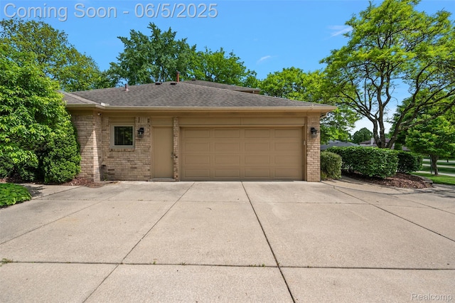 6730 Whiting Dr, Troy, MI 48098 - garage featuring concrete driveway