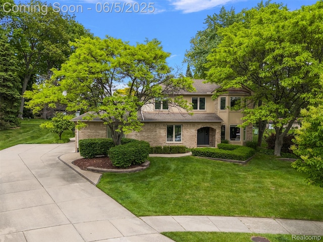 6730 Whiting Dr, Troy, MI 48098 - view of front of property featuring a front lawn and brick siding