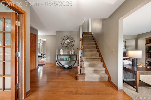 6730 Whiting Dr, Troy, MI 48098 - stairway featuring wood finished floors and baseboards