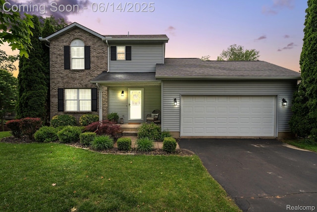 9299 Appleview Ct, Brighton, MI 48116 - traditional-style home with a front lawn, driveway, a garage, and brick siding