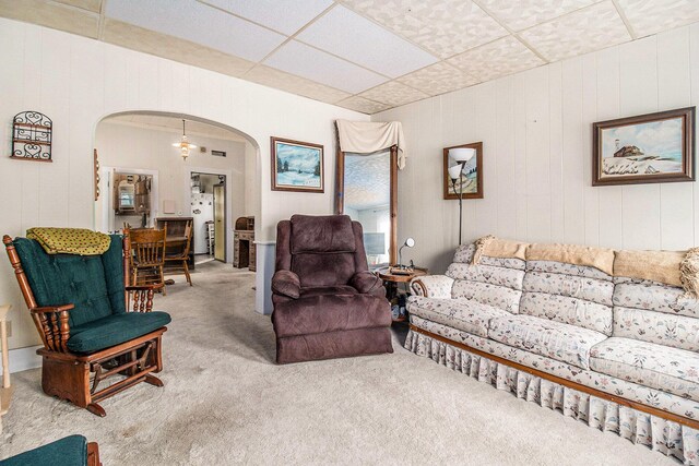 1754 Maggie St, Fountain, MI 49410 - living room with arched walkways, carpet, and a drop ceiling