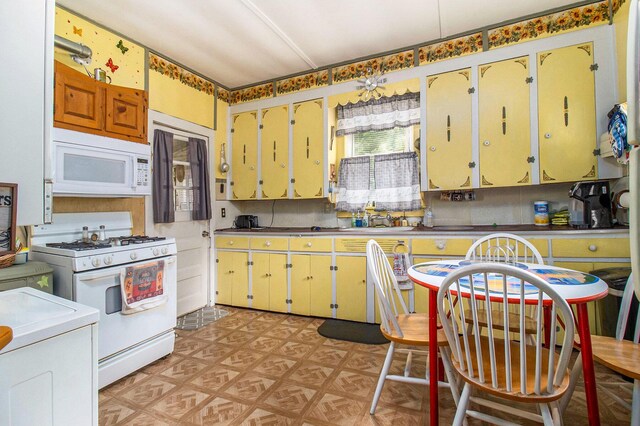 1754 Maggie St, Fountain, MI 49410 - kitchen with white appliances, light floors, a sink, and washer / clothes dryer