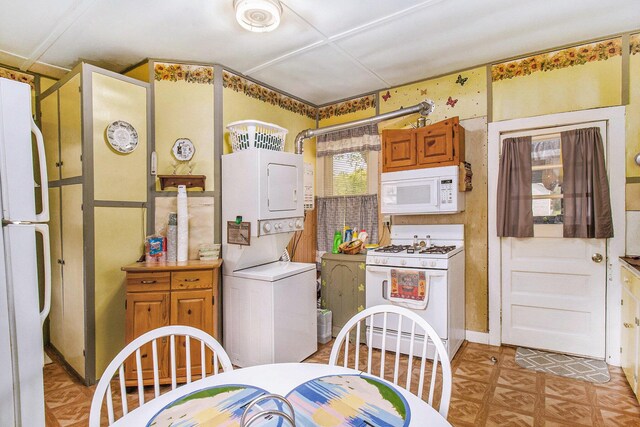 1754 Maggie St, Fountain, MI 49410 - kitchen with white appliances and estacked washer and dryer