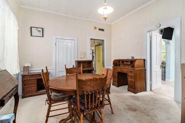1754 Maggie St, Fountain, MI 49410 - dining area with ornamental molding, light colored carpet, and wood walls