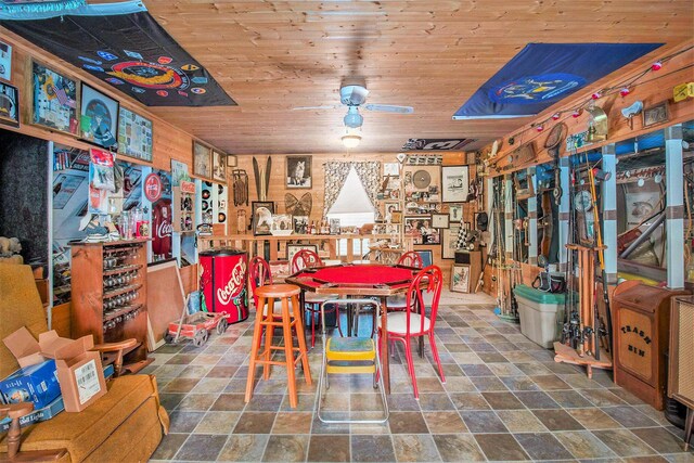 1754 Maggie St, Fountain, MI 49410 - dining area featuring stone finish flooring, wooden ceiling, and ceiling fan