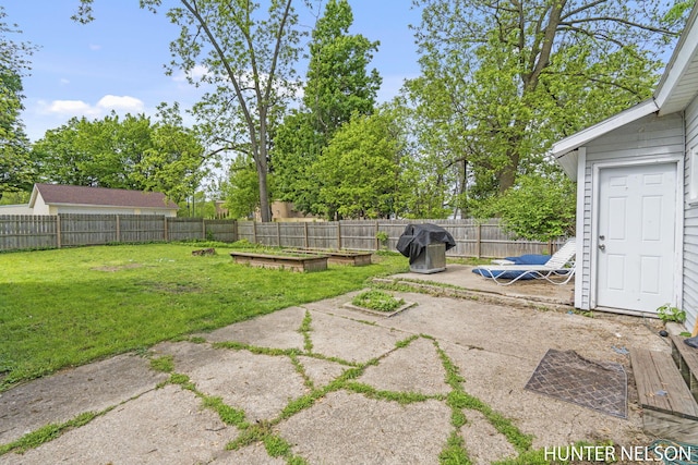 138 E Lake St, Sand Lake, MI 49343 - view of yard with a patio area and a vegetable garden