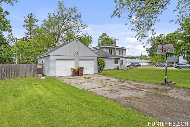 138 E Lake St, Sand Lake, MI 49343 - view of home's exterior with a garage and an outdoor structure